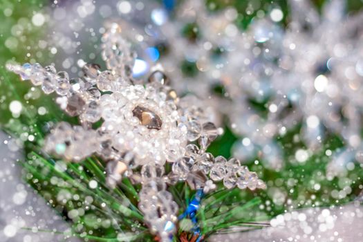 Beautiful crystal snowflake on a fir tree. Christmas snow.  New year's greetings, greeting card, calendar. 