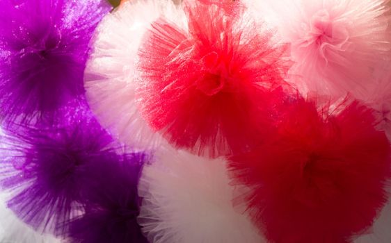 Collection of  fluffy pompons. The concept of touch, tactility, feelings.