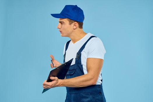 a man in a construction form a box in the hands of a professional service. High quality photo