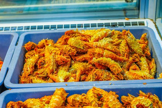 Seafood in the window of the shopping pavilion of the city market. Vladivostok, Russia