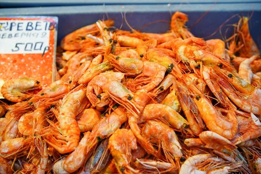 Seafood in the window of the shopping pavilion of the city market. Vladivostok, Russia