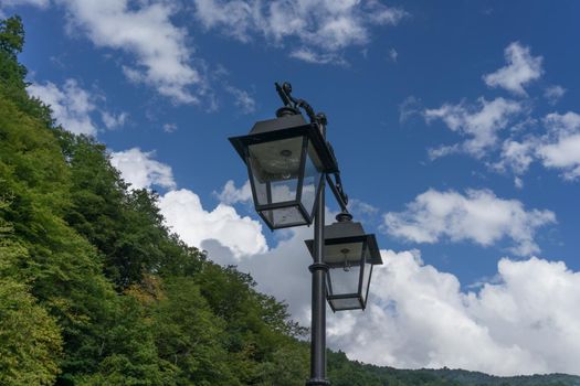 lights in antique style on the background of blue sky with clouds