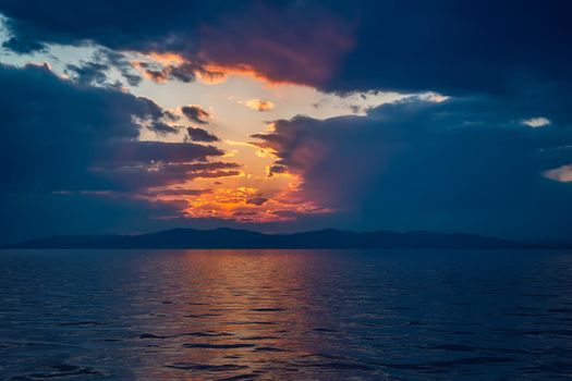 Seascape with a dark dramatic sunset.