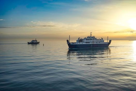 Kerch Strait at sunset, view of the sea and ships.