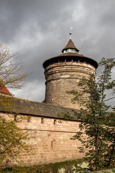 Old wall and tower at Handwerkerhof in city Nuremberg, Bavaria, Germany  in autunm