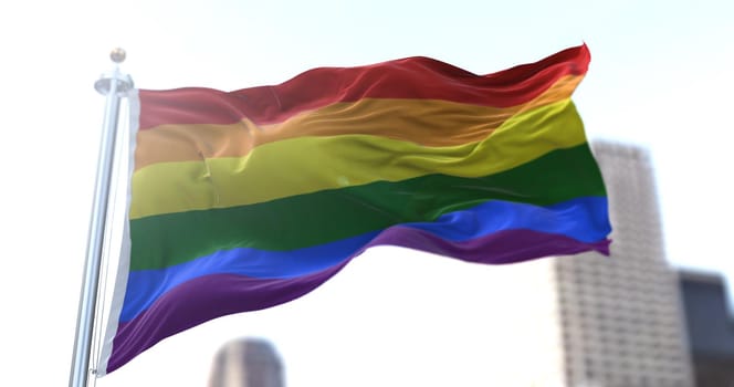 the rainbow flag flapping in the wind. Symbol of gay pride and peace. Human rights