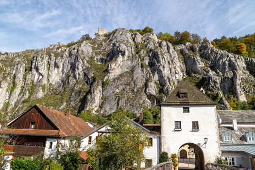 Brucktor in Essing in Bavaria, Germany at the Altmuehl river on a sunny day in autumn with blue sky and white clouds