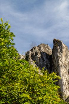High rocks in the village Essing in Bavaria, Germany at the Altmuehl river on a sunny day in autumn with blue sky and white clouds
