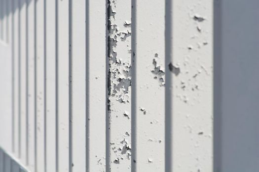 Detail of metal fence painted in white