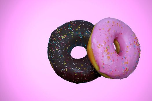 Pink Cream Donuts and Chocolate Donuts Pink background isolated.
