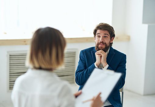 emotional man talking to psychologist professional consultation patient diagnosis. High quality photo