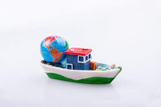 Little model globe on a boat in view