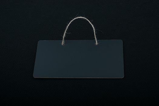 Rectangular shaped black notice board on black background