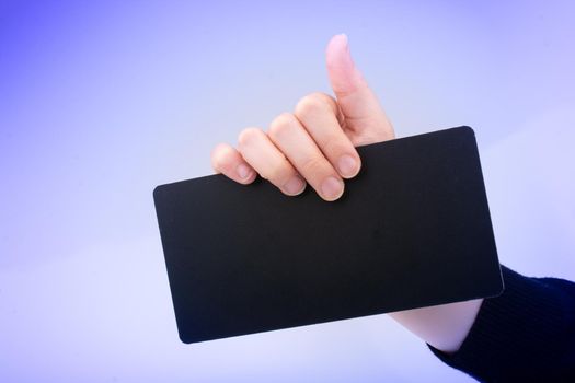 Rectangular shaped black notice board in hand on white background