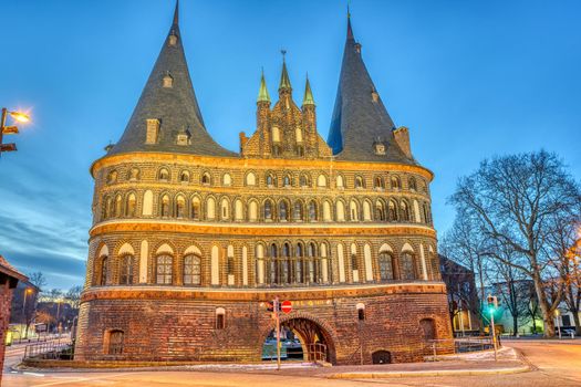 The historic Holsten Gate in Luebeck, Germany, at dusk