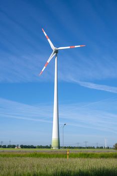 Wind turbine in front of a blue sky in Germany
