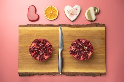 ripe pomegranate on a pink background. love. Fruit. High quality photo