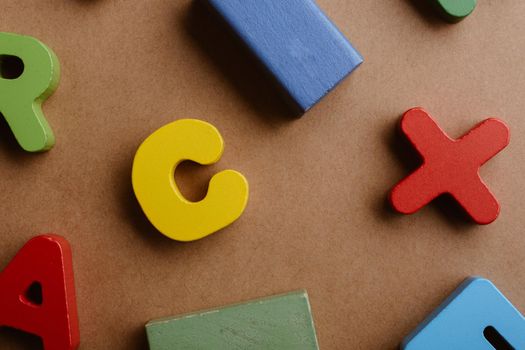 Wooden letters and blocks on a wooden background