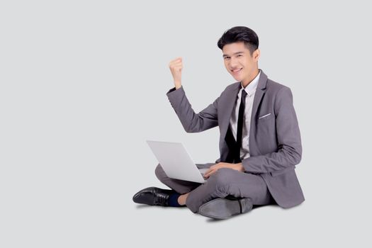 Young asian business man sitting work on laptop computer to internet online isolated on white background, businessman confident and notebook, freelance with success, marketing and communication.