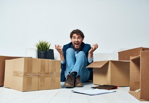 Business man emotions boxes with lifestyle things unpacking. High quality photo