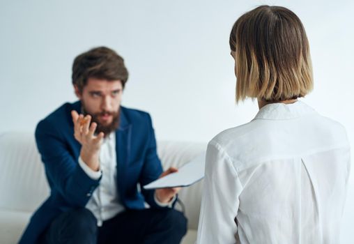 Men and women in suits of colleagues at work office communicating. High quality photo