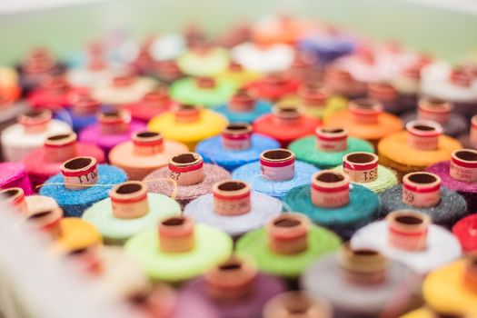 Variety of colorful sewing threads, birds eye