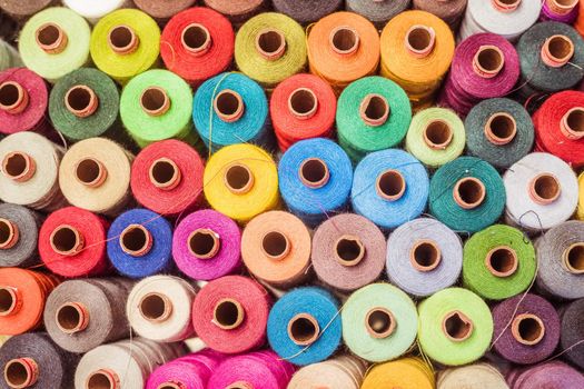 Variety of colorful sewing threads, birds eye