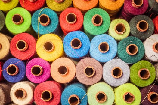 Variety of colorful sewing threads, birds eye