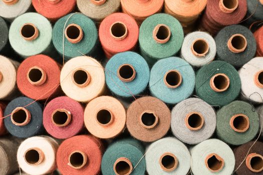 Variety of colorful sewing threads, birds eye