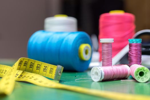 Close up of measuring tape and sewing thread a textile workshop