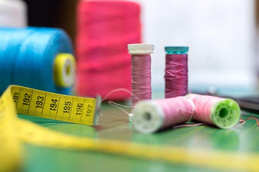 Close up of measuring tape and sewing thread a textile workshop