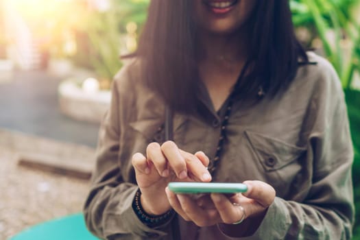 Woman hand using smartphone to do work business, social network, communication concept.