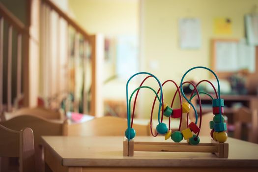 Close up of colorful wooden toy for learning and socialization