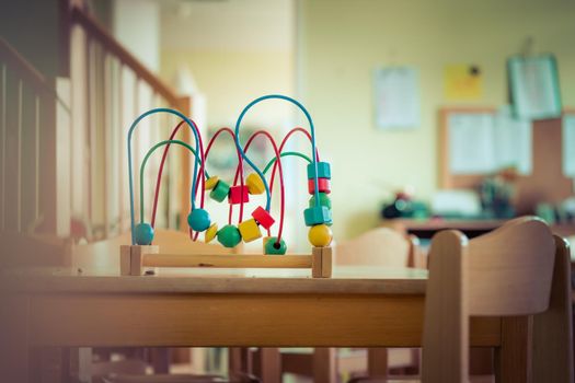 Close up of colorful wooden toy for learning and socialization
