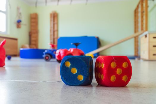 Close up of toy foam cubes in a gym hall of a Kindergarten