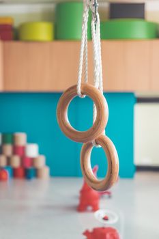 Close up of gym rings in the gym hall of a preschool