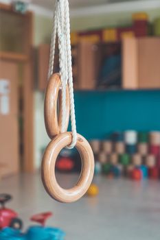 Close up of gym rings in the gym hall of a preschool