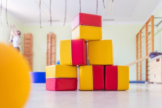 Close up of toy foam cubes in a gym hall of a Kindergarten