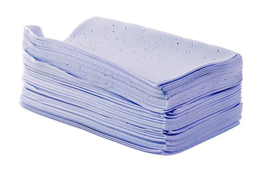 stack of purple liquidless and powderless laundry detergent squares sheets isolated on white background.