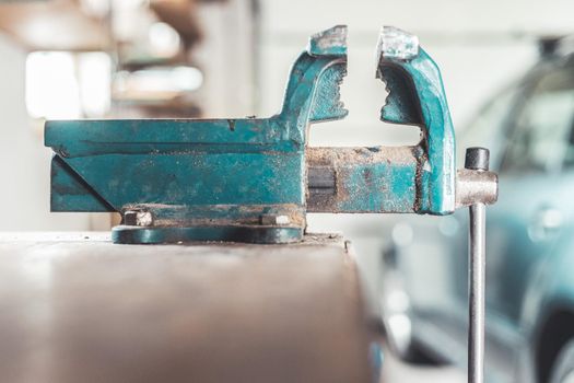 Close up of a metal vice in a garage workshop