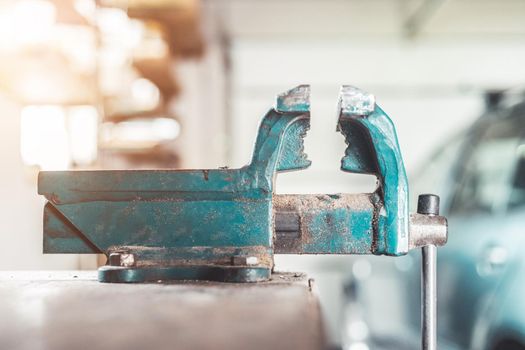 Close up of a metal vice in a garage workshop