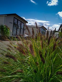 Beautiful view of holiday mobile homes from the perspective of grass