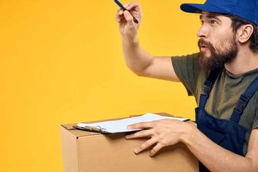 man in work uniform blue cap toolbox cheating. High quality photo