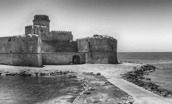 View of the scenic Aragonese Castle, aka Le Castella, on the Ionian Sea in the town of Isola di Capo Rizzuto, Italy