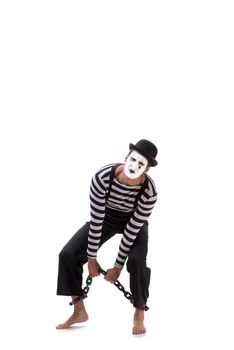 Mime with his feet chained isolated on white