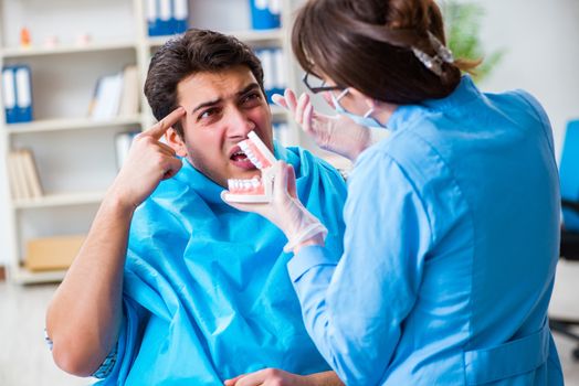 Patient afraid of dentist during doctor visit