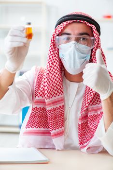 Arab chemist working in the lab office