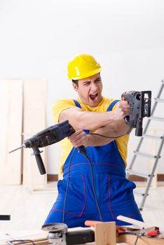 Floor repairman disappointed with his work 