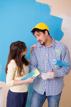 Husband and wife doing renovation at home