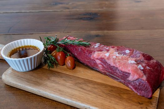 Argentine cut of meat called Vacio with chorizos and chimichurri.